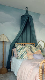 Nuage pale blue sky and white cloud peel and stick mural by Anewall styled in a nursery
